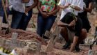 Another burial in a cemetery in Rio de Janeiro, Brazil. The nation  registered  4,211 deaths from Covid-19 on Monday, a record for a 24-hour period. Photograph: Antonio Lacerda/EPA