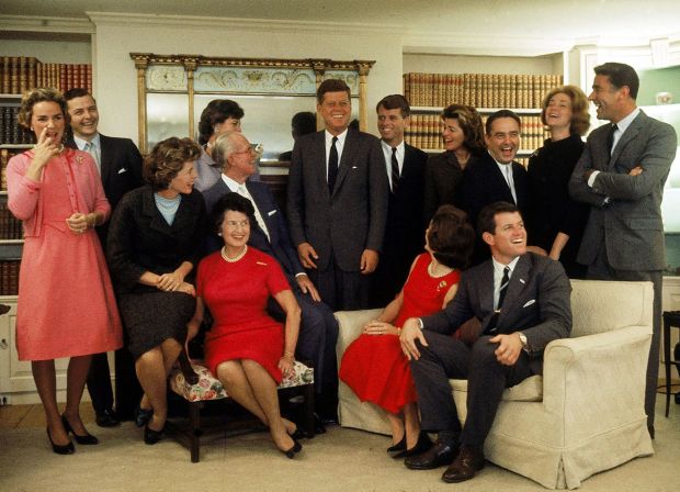 The Kennedys at Hyannis Port the night after John won the 1960 US presidential election: Eunice Shriver (on chair arm), Rose Kennedy, Joseph Kennedy, (on chair arm), Jacqueline Kennedy (head turned away from camera) and Ted Kennedy. Back row, Ethel Kennedy, Stephen Smith, Jean Smith, John F Kennedy, Robert F Kennedy, Pat Lawford, Sargent Shriver, Joan Kennedy and Peter Lawford. Photograph: Paul Schutzer/Time & Life/Getty