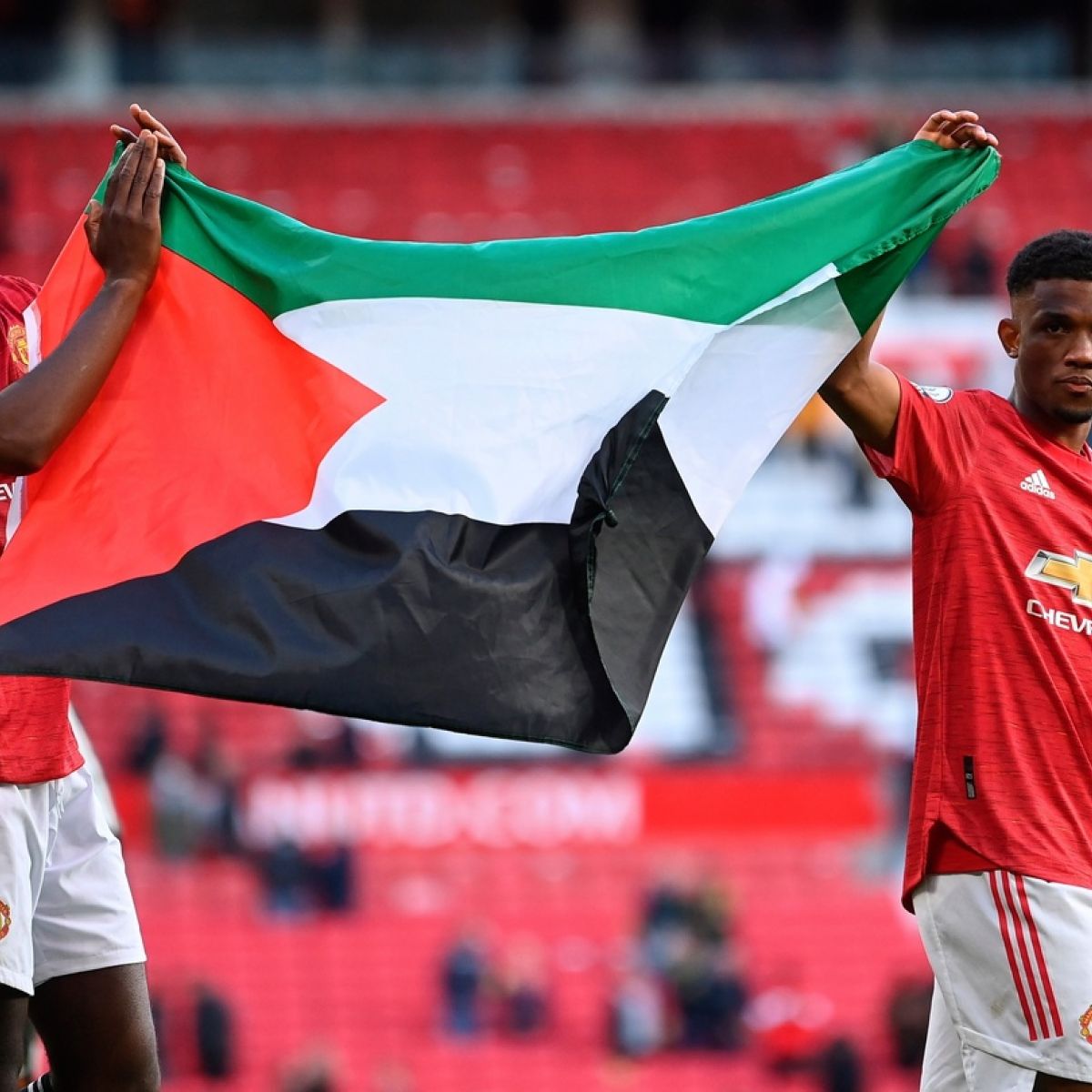 Manchester United Players Hold Up Palestine Flag At Old Trafford