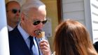 US president Joe Biden eats an ice cream at Honey Hut Ice Cream in Cleveland, Ohio, on Thursday. Photograph: Nicholas Kamm/AFP via Getty Images