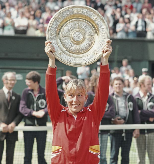 Martina Navratilova lefts the Wimbledon trophy after bearing Chris Evert in 1982. Photograph: Steve Powell/Allsport//Getty