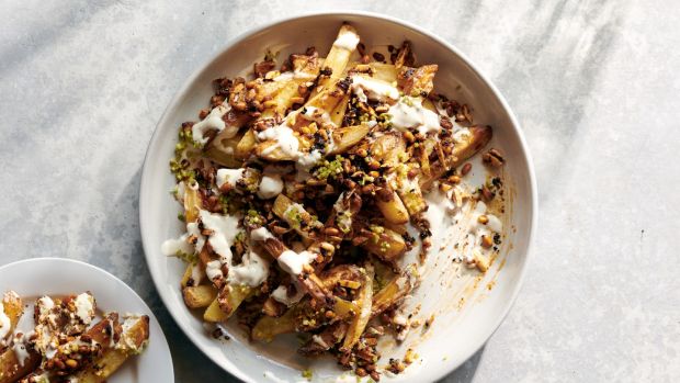 Oven fries with tahini yogurt and smoky sweet nuts. Photogrsaphs: David Malosh/The New York Times