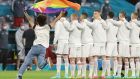  A person waving the rainbow flag runs on the pitch as the players line up for the national anthems before the Germany-Hungary match in Munich at  the Euro Championships. Photograph:  Alexander Hassenstein/POOL/AFP via Getty Images