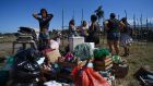 Women after being evicted from a settlement of homeless people set up during the Covid-19 pandemic in Rio de Janeiro state. Photograph: Mauro Pimentel/AFP via Getty