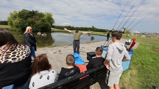 Rory Keatinge, Dublin Angling Initiative Co-ordinator and Sue Hanlon, youth worker, with the Sphere 17 youth group at Darndale Park. Photograph: Nick Bradshaw