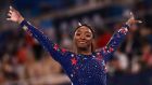  Simone Biles reacts after competing in the artistic gymnastics balance beam event of the women’s qualification during the Tokyo   Games. Photograph: Loic Venance/AFP via Getty Images