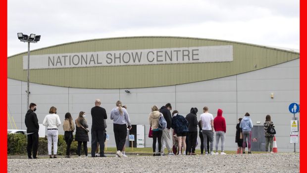 People queue outside a walk-in vaccination centre at the National Show Centre in Swords, Dublin, on Sunday. Photograph: Damien Eagers/PA Wire