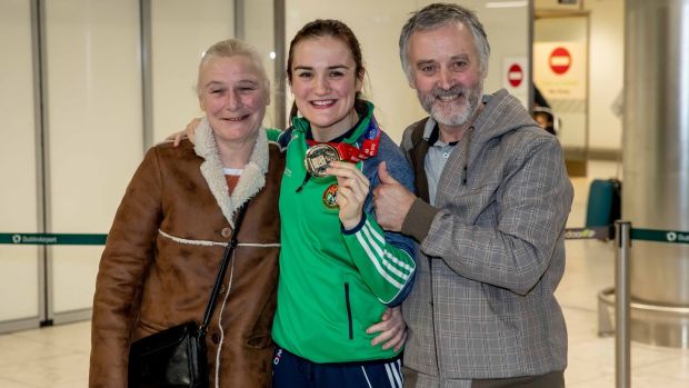 Harrington with her parents at Dublin Airport after winning the world title in 2018. Photo: Morgan Treacy/Inpho