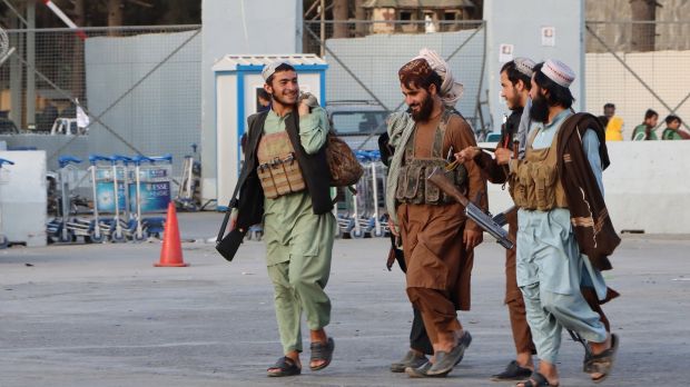 Taliban patrols outside Hamid Karzai International Airport in Kabul, Afghanistan. Photograph: EPA/STRINGER