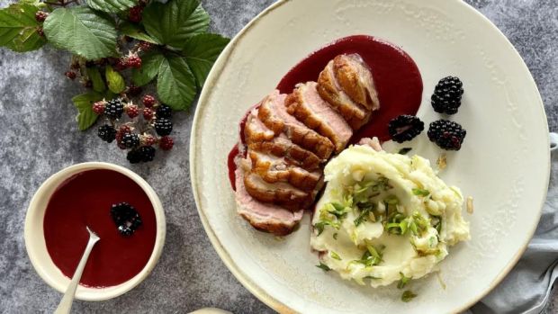 Duck with blackberry sauce and spring onion champ