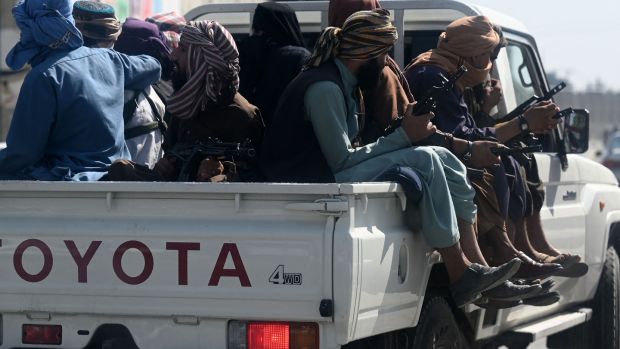 Taliban fighters patrol outside Kabul airport. Photograph: Aamir Qureshi/AFP via Getty