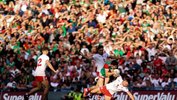 Mayoâ€™s Lee Keegan with Darren McCurry of Tyrone. Photo: Tommy Dickson/Inpho