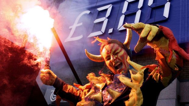 A dancer dressed as a dragon burns a flare in front of the launched Telecom Éireann share offer price in Dublin on July 7th, 1999. Photograph: RTÉ