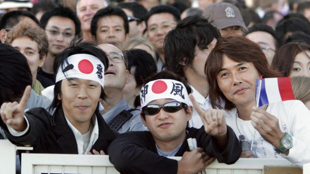 An estimated 15,000 fans travelled to Longchamp from Japan to watch Deep Impact bid for the Prix de l'Arc de Triomphe race at Longchamp in 2006. Photograph: Betrand Guay/AFP/via Getty Images