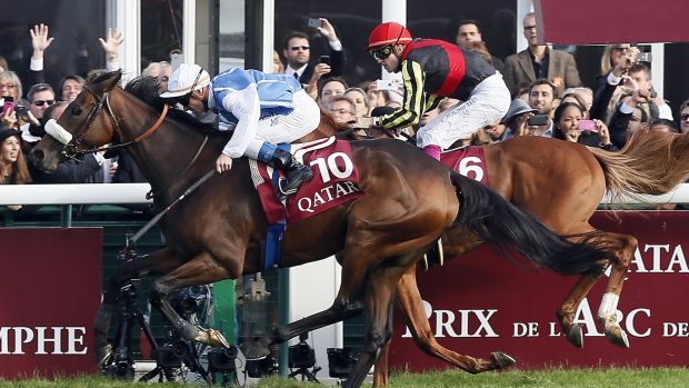 Olivier Peslier (left) riding Solemia crosses the finish line ahead of Christophe Soumillon on Orfevre from Japan to win the Prix de l'Arc de Triomphe in 2012 at Longchamp. Photograph: Kenzo Triboillard/AFP/Getty Images