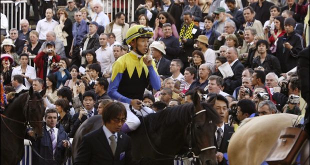 Yutaka Take riding Deep Impact before the Prix de l'Arc de Triomphe in 2006. The Japanese favourite fluffed his lines by finishing only third. Those at Longchamp that day recall stunned Japanese fans weeping as they left the grandstand. Photograph: Alain Benainous/Gamma-Rapho via Getty Images