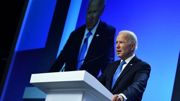 US president Joe Biden delivers a speech on stage Cop26. Photograph: Brendan Smialowski/AFP via Getty