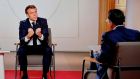 French president Emmanuel Macron (left) answers questions of journalist Darius Rochebin during a televised interview at the Élysée Palace in Paris. Photograph: Ludovic Marin/AFP via Getty