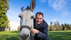  Minister for Agriculture Charlie McConalogue with ‘Ronnie’ the donkey  at Farmleigh House. Photograph: Colin Keegan/Collins Dublin