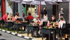 Outdoor diners on  Capel Street: Next year doesn’t have to be about sitting on a curb drinking a pint out of a plastic glass. Photograph: Alan Betson 