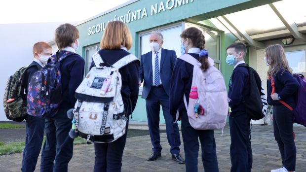 Bryan Collins, principal ofScoil Náisiúnta Naomh Feichín, Termonfeckin, Co Louth, greets pupils arriving to school. Photograph: Dara Mac Dónaill