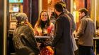 Socialising in Temple Bar following the easing of Covid-19 restrictions: The Taoiseach pulled a rabbit from a hat, and in a puff of smoke, the pandemic was gone. In reality, that’s not exactly the case. Photograph: Damien Storan/PA 