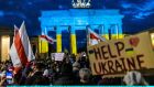  People protesting in front of the Brandenburg Gate in Berlin against the Russian invasion of Ukraine. Photograph:   Hannibal Hanschke/Getty Images
