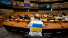 A Member of European Parliament wears a shirt in support of Ukraine during an extraordinary session on Ukraine. Photograph: Virginia Mayo