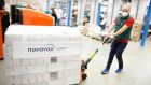 A man pulls a pallet with the Nuvaxovid vaccine made by  US company Novavax after a shipment  arrived  at a warehouse in Hagenbrunn, lower Austria. Photograph:   FLORIAN WEISER/ Getty Images