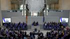 Politicians applaud Volodymyr Zelenskiy, Ukraine’s president, after an address via video link at the Bundestag in Berlin, Germany, Photographer: Liesa Koppitz-Johanssen/Bloomberg