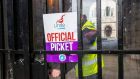 A Unite Union official picket sign placed on the door of the rear entrance at Belfast City Hall on Monday. Photograph: Liam McBurney/PA Wire