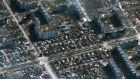 This Maxar satellite image taken on March 19th shows Russian tanks and armored vehicles in the streets and destroyed buildings in Mariupol, Ukraine. Photograph: Satellite image ©2022 Maxar Technologies/AFP via Getty Images