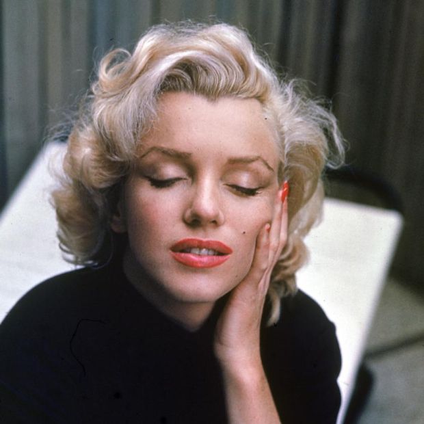 On the patio outside of her home, American actress Marilyn Monroe (1926 - 1962), eyes closed, rests her hand on her cheek, Hollywood, California, May 1953. (Photo by Alfred Eisenstaedt/Time Life Pictures/Getty Images)