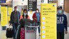  Masked passengers at Dublin Airport: The Government was slower than all other EU states to reopen for travel last year. Photograph: Colin Keegan