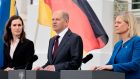 From left: Finnish prime minister Sanna Marin, German chancellor Olaf Scholz and Swedish prime minister Magdalena Andersson speak to the media after a three-way meeting near Berlin on Tuesday. Photograph: Hannibal Hanschke/Getty Images