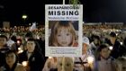 A pilgrim holds a portrait of kidnapped British girl Madeleine McCann during a candlelight vigil at the Fatima’s holy shrine in central Portugal, May 2007. Photograph: Nacho Doce/Reuters