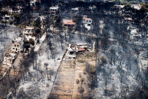 Greece reels from wildfires as death toll climbs to 80