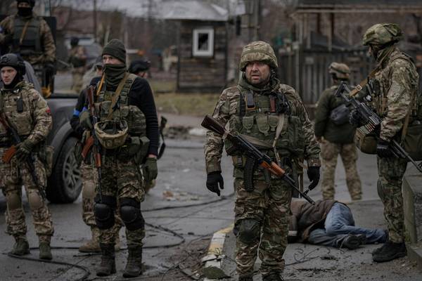 ‘No impunity’ for Russia, says Coveney, as mass graves and bodies found on streets of Ukraine