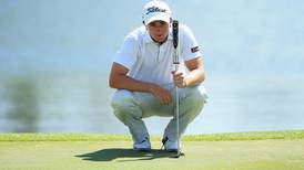 Paul Dunne battles the wind to stay in touch on the Gold Coast
