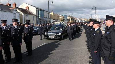 Streets at a standstill as Garda Golden is laid to rest