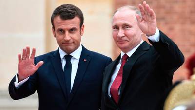 Macron talks tough as Putin goes on defensive in Versailles