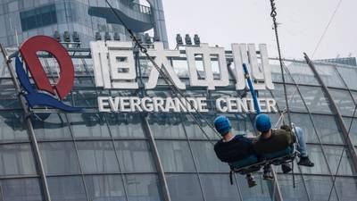 Evergrande shares tumble as new deadline for debt payment looms