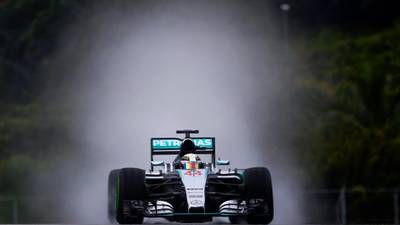 Lewis Hamilton slips and slides his way to Malaysia pole