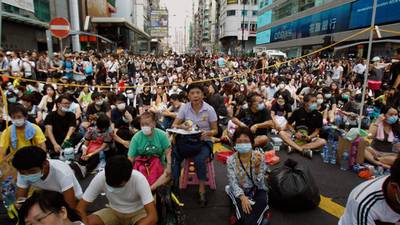 Eyes reddened, Hong Kong protesters tired but driven