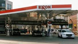 Exxon and Chevron profits slide from record highs
