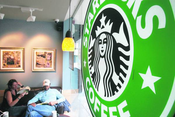 Starbucks reports profit growth but sounds warning