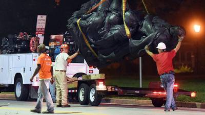 Baltimore takes down Confederate statues in middle of night