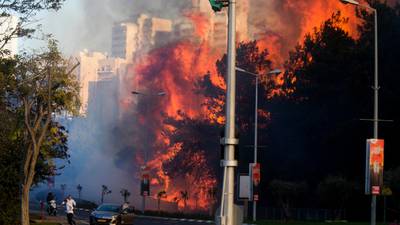 Tens of thousands flee wildfires across Israel