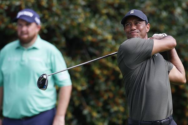 US Masters: Tiger Woods settles back into his domain as Shane Lowry struggles
