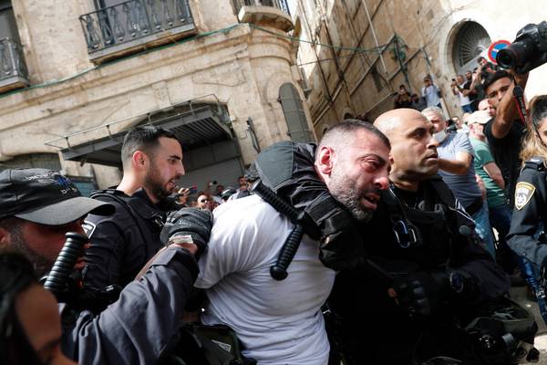 Israeli police baton charge mourners at Palestinian journalist’s funeral